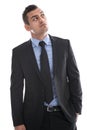 Business: young man in suit thinking with hand in pocket isolate Royalty Free Stock Photo