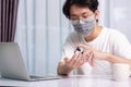 Business young man working from home office he quarantines disease coronavirus or COVID-19