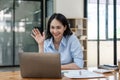 business young woman having video call via laptop in the office Royalty Free Stock Photo