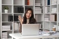 business young woman having video call via laptop in the office Royalty Free Stock Photo