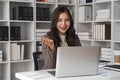 business young woman having video call via laptop in the office Royalty Free Stock Photo