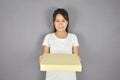 young woman holding pizza box for delivery services to customer. Royalty Free Stock Photo