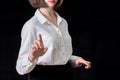 Business young woman pointing her finger at you, isolated on black background. Business concept Royalty Free Stock Photo