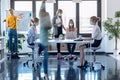 Business young women wearing a hygienic face mask while working in the office. Multiple exposure