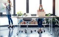 Business young women wearing a hygienic facial mask working in the office while keeping safe distances