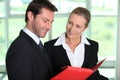 Businesscouple looking at paperwork Royalty Free Stock Photo