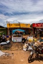 Businesses along a rural street on the outskirts of Kampala show the spirit of Ugandans Royalty Free Stock Photo