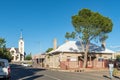 Businesses, people, vehicles and church, in Prieska