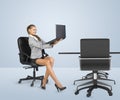 Businesslady sitting half-turned in chair and