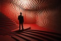 a businessman in a abstract surreal red and white room with various steps, shapes and levels. Royalty Free Stock Photo