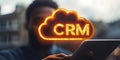 Businessman Accessing Cloud CRM System On Mobile Device, Illuminated Text In Cloud Icon