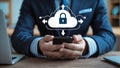 Businessman accessing cloud security using smartphone mobile application on a wooden desk Royalty Free Stock Photo