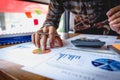 Businessman or accountant working about financial and analysis business document with calculator and holding glasses to Royalty Free Stock Photo