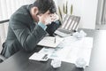 Businessman acted with tired stress anxiety from the frustrated business crisis, paperwork paper cube mess chaos on the table Royalty Free Stock Photo