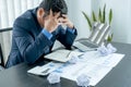 Businessman acted with tired stress anxiety from the frustrated business crisis, paperwork paper cube mess chaos on the table Royalty Free Stock Photo