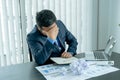 Businessman acted with tired stress anxiety from the frustrated business crisis, paperwork paper cube mess chaos on the table Royalty Free Stock Photo