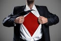 Businessman Acting Like A Super Hero And Tearing His Shirt