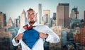 Businessman acting like super hero and tearing Royalty Free Stock Photo