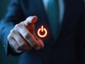 Businessman pressing power button starting new project