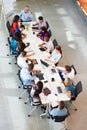 Businessman Addressing Meeting Around Boardroom Table Royalty Free Stock Photo