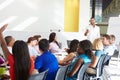 Businessman Addressing Meeting Around Boardroom Table Royalty Free Stock Photo