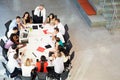 Businessman Addressing Meeting Around Boardroom Table Royalty Free Stock Photo