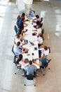 Businessman Addressing Meeting Around Boardroom Table Royalty Free Stock Photo