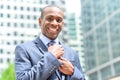 Businessman adjusting his collar outdoors