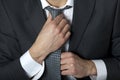 Businessman adjusting his tie Royalty Free Stock Photo