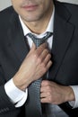 Businessman adjusting his tie Royalty Free Stock Photo