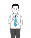 Businessman adjusting necktie