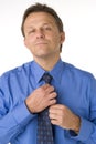 Businessman Adjusting Tie