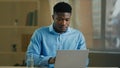 Businessman african american man working on computer in home office make pause drinking glass of cold fresh water health Royalty Free Stock Photo