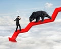 Businessman against bear on arrow downward trend line with sky Royalty Free Stock Photo