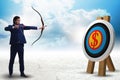 Businessman aiming arrow with bow Royalty Free Stock Photo