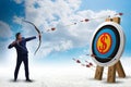 Businessman aiming arrow with bow Royalty Free Stock Photo