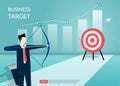 Businessman aiming the target with arrow. Man character shooting at the target. graph and chart symbol background. Focus on target Royalty Free Stock Photo
