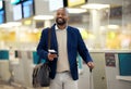 Businessman, airport and passport with plane ticket ready for travel, departure or flight time by help desk. African Royalty Free Stock Photo