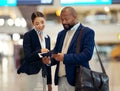 Businessman, airport and service agent helping traveler with passport in departure, flight time or information. Black Royalty Free Stock Photo