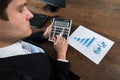 Businessman Analyzing Financial Data With Calculator Royalty Free Stock Photo