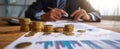The businessman analyzing financial data with coins and reports on the desk..AI generated image Royalty Free Stock Photo