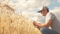 Businessman analyzing grain harvest. farmer working with tablet computer on wheat field. agricultural business Royalty Free Stock Photo