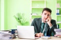 The businessman angry with excessive work sitting in the office Royalty Free Stock Photo