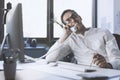 Businessman answering phone calls in the office Royalty Free Stock Photo