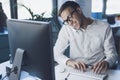 Businessman answering phone calls in the office Royalty Free Stock Photo