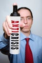 Businessman with anticrisis spray. Royalty Free Stock Photo