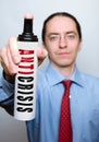 Businessman with anticrisis spray. Royalty Free Stock Photo