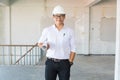 Businessman or Architect Engineer wear Hardhat in White Shirt ho