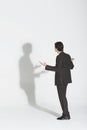 Businessman Arguing With Own Shadow