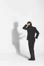 Businessman Arguing With Own Shadow